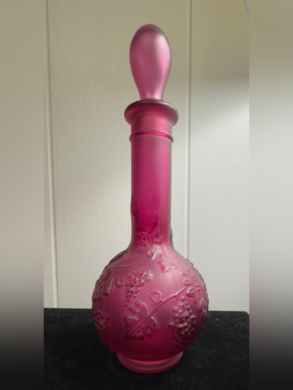 Vintage Avon Skin-So-Soft frosted magenta or purple glass decanter with a matchi